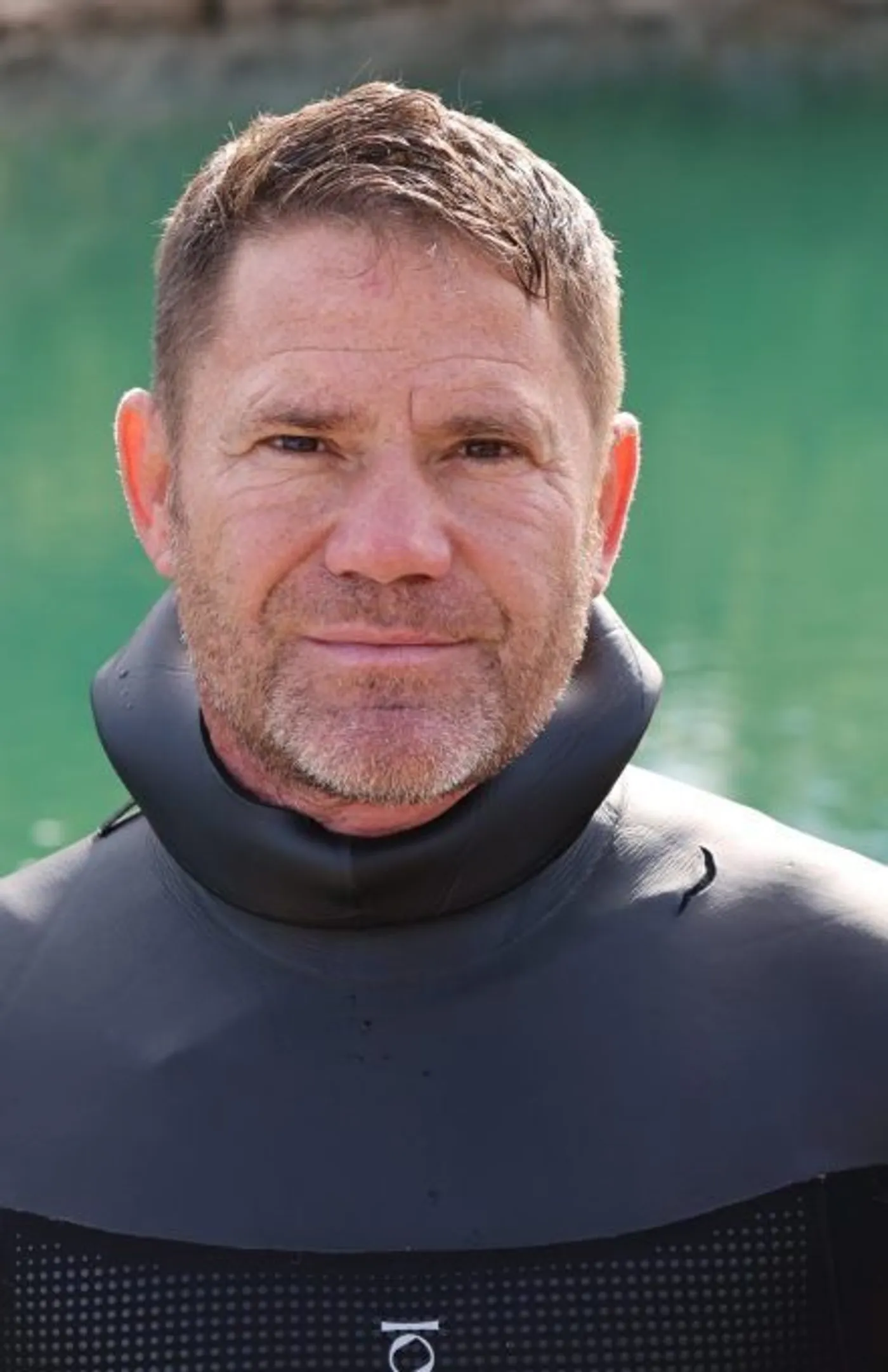 Steve Backshall, wildlife expert, portrait beside water